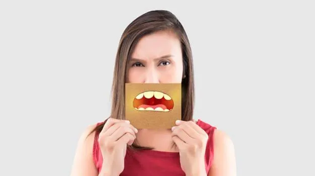 A Lovely Young Lady Covers Her Mouth With A Carton Mouth Drawn On Cardboard.