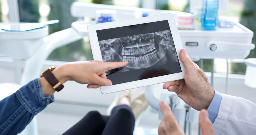 Dentist shows patient their digital x-ray