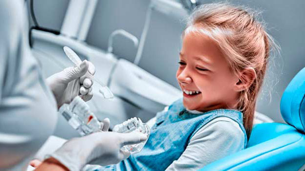 A Little Girl Child Having A Happy Time With Dentist Appointment